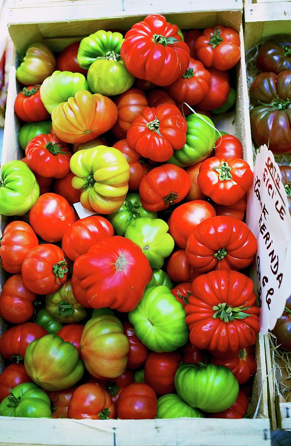 Colourful merinda Tomatoes In A Wooden Crate At A Market In France Photograph by Sabine Mader
