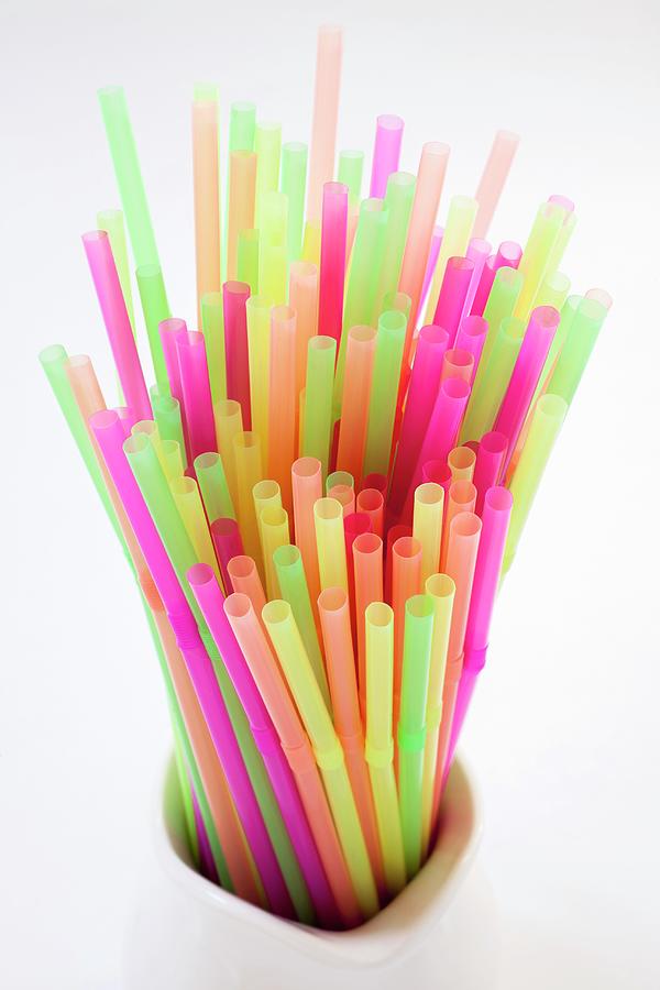 Colourful Neon Straws In A Pitcher Photograph by Katharine Pollak