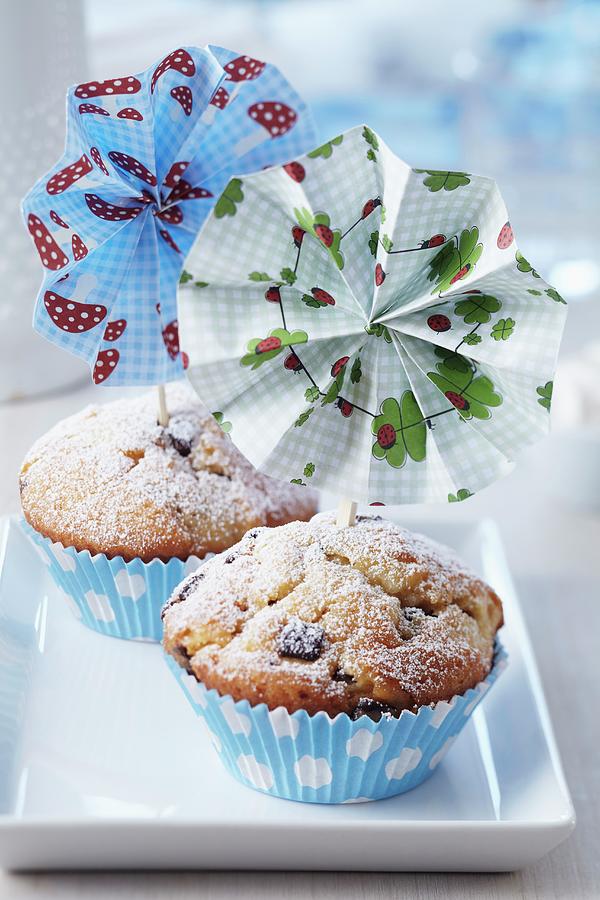Colourful Paper Flowers Attached To Small Wooden Forks Decorating Muffins Photograph by Franziska Taube