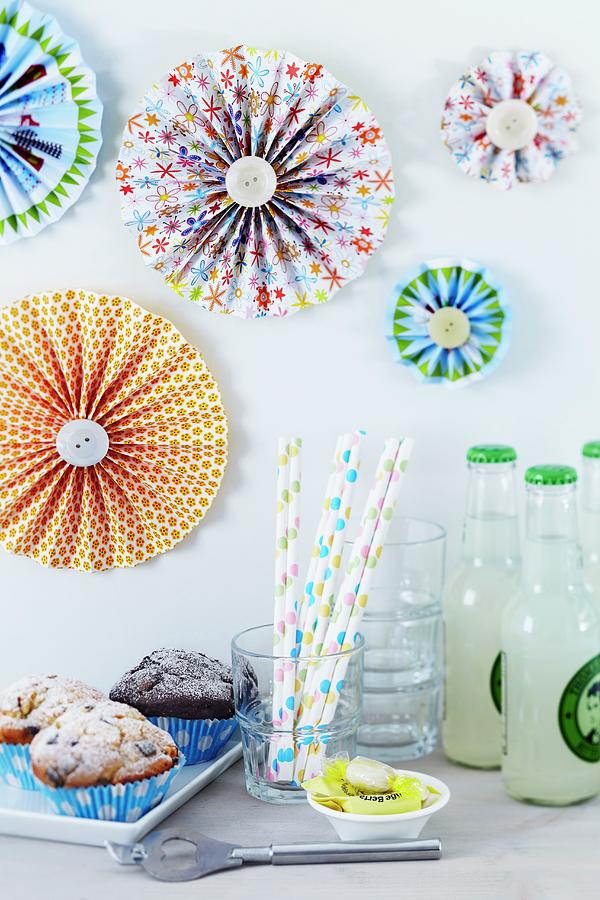 Colourful Paper Flowers Decorating Wall Above Party Buffet With Muffins Photograph by Franziska Taube