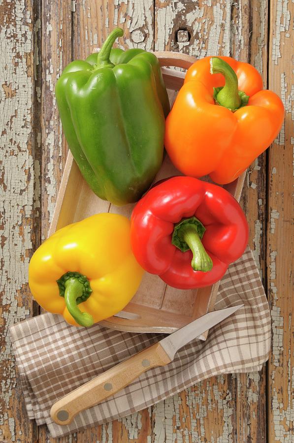 Colourful Peppers On A Wooden Tray Photograph by Jean-christophe Riou