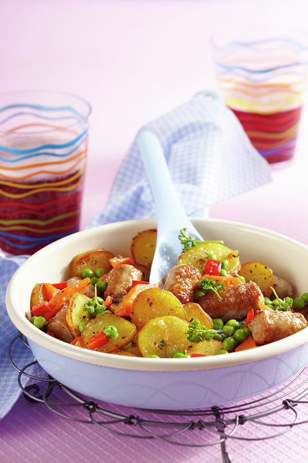 Colourful Roast Potatoes With Peas And Peppers Photograph by Teubner Foodfoto