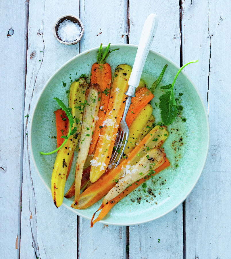 Colourful Roasted Carrots With Salt Flakes Photograph by Udo Einenkel