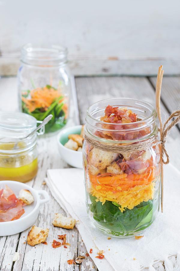 Colourful Salad With Vegetables, Bacon, Cheddar, Croutons And Lemon And Honey Dressing In A Glass Jar Photograph by Maricruz Avalos Flores