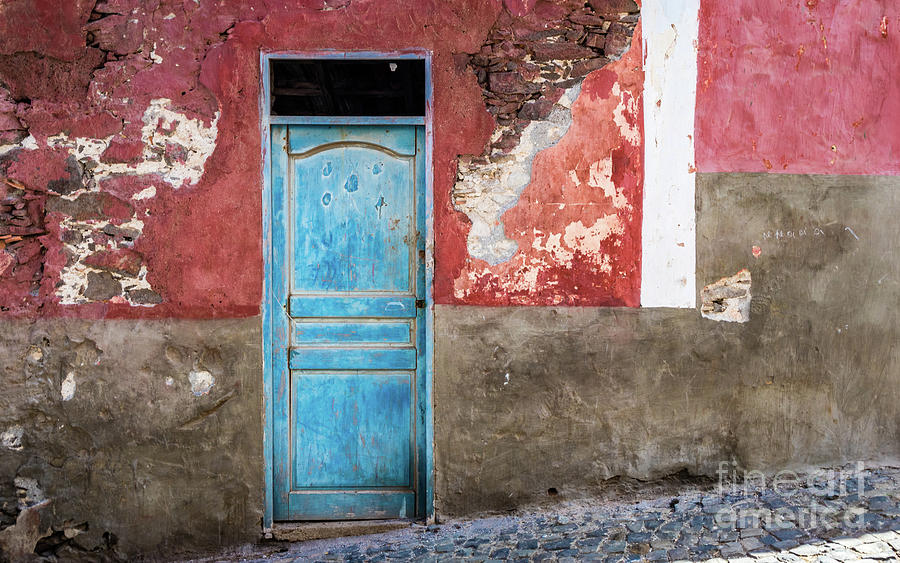 Colorful wall with blue door Photograph by Lyl Dil Creations