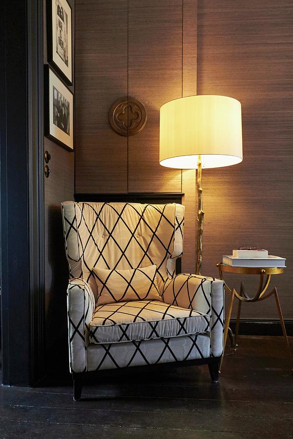 Comfortable Reading Chair Next To Lit Standard Lamp And Brass Side Table Photograph by Misha Vetter