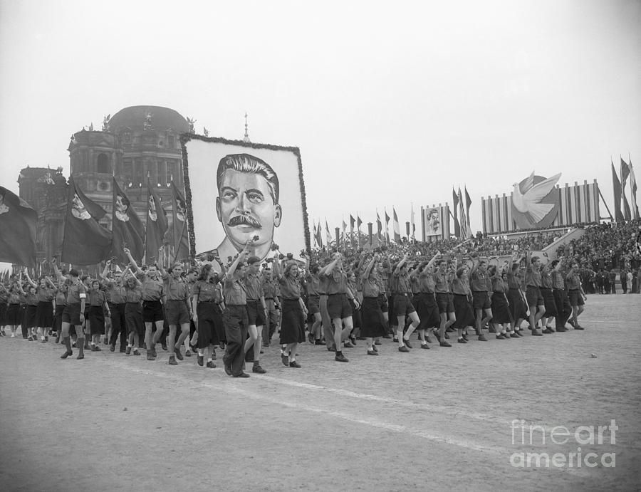 Communist Youths Carry Stalin Picture Photograph by Bettmann