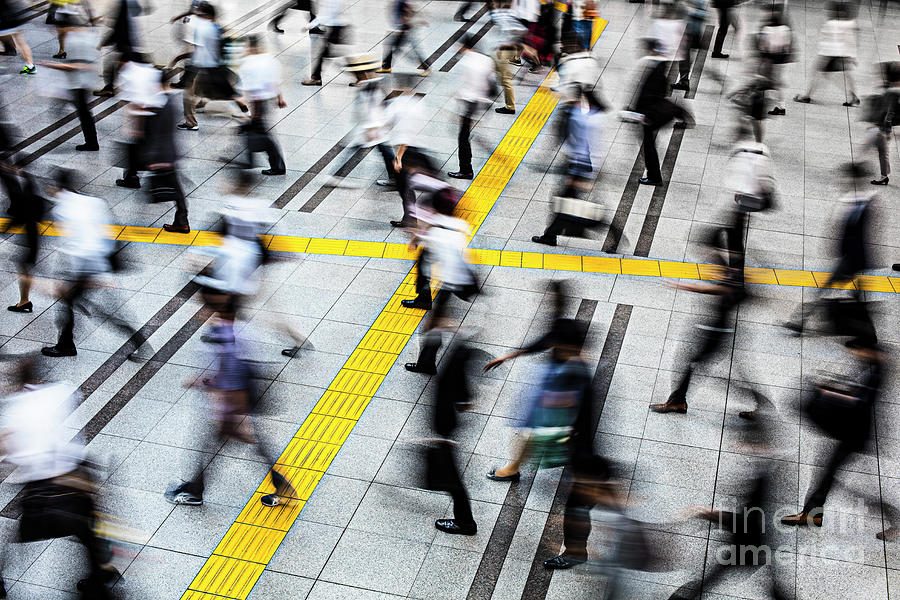 Commuters In A Station At Tokyo Photograph by Xavierarnau