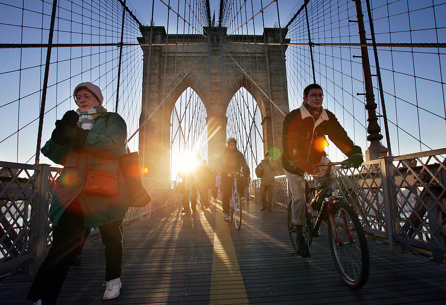 Commuters Walk And Ride Bicycles Across Photograph by New York Daily News Archive