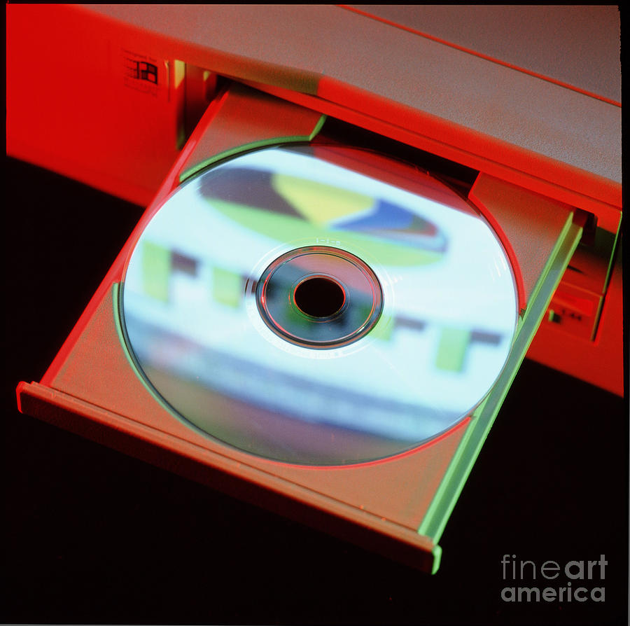 Compact Disc In A Computer Cd-rom Disc Drive Photograph by Steve Horrell/science Photo Library