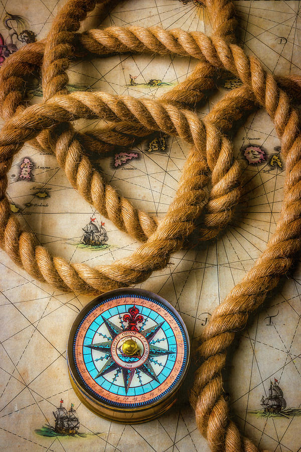 Compass And Rope On Old Map Photograph by Garry Gay