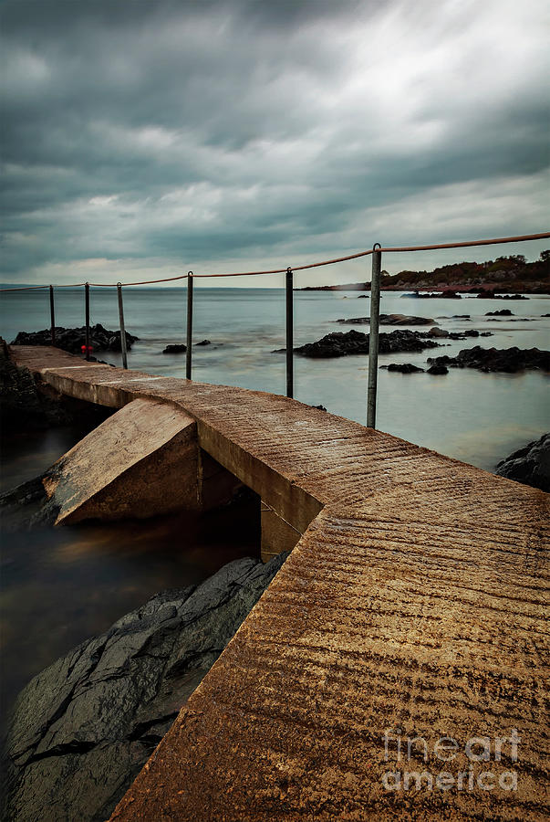 Concrete jetty on stormy day Photograph by Sophie McAulay