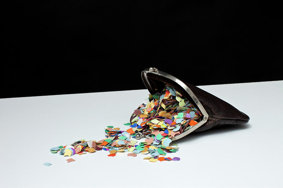 Confetti Spilling Out Of A Coin Purse Photograph by Benne Ochs
