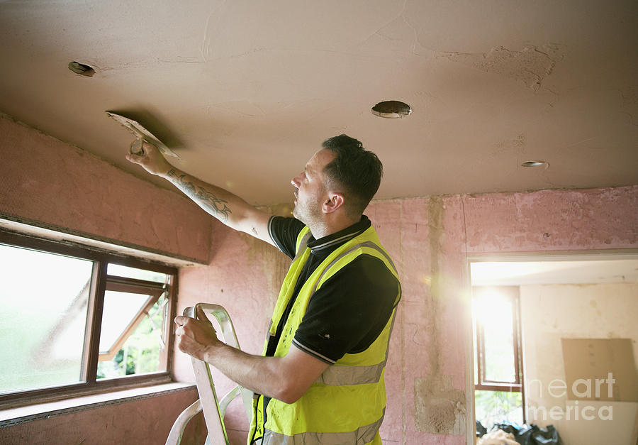 Construction Worker Plastering Ceiling In House Photograph ...