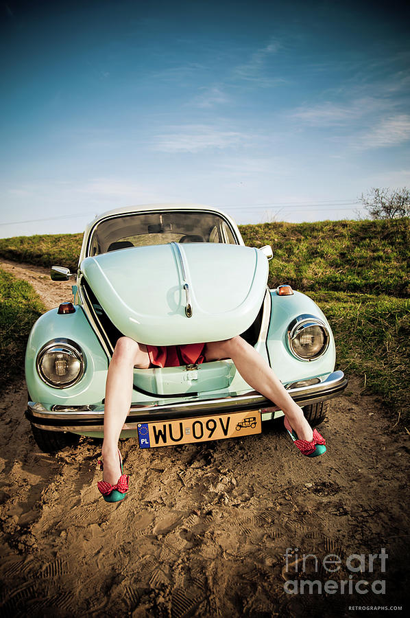 Contemporary Image Of 1970s Volkswagen Beetle With Womans Legs From Trunk Photograph by Retrographs