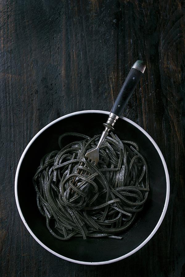 Cooked Black Cuttlefish Ink Spaghetti Over Black Background. View From ...