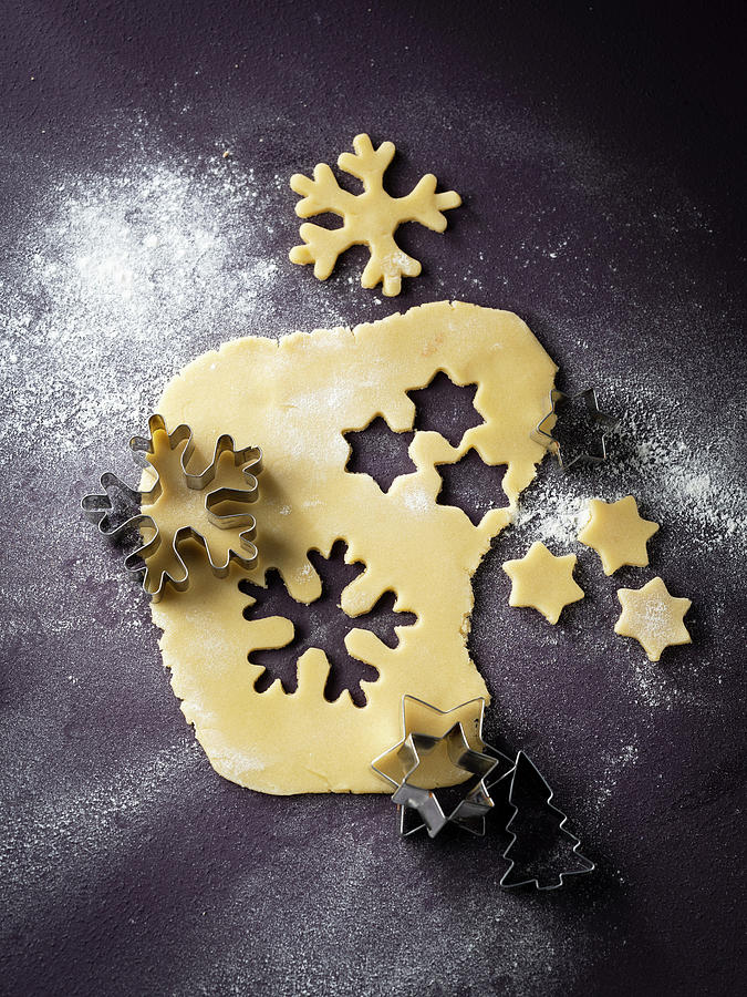 Cookie Dough With Punched Out Christmas Cookies Photograph by Manuela Rther
