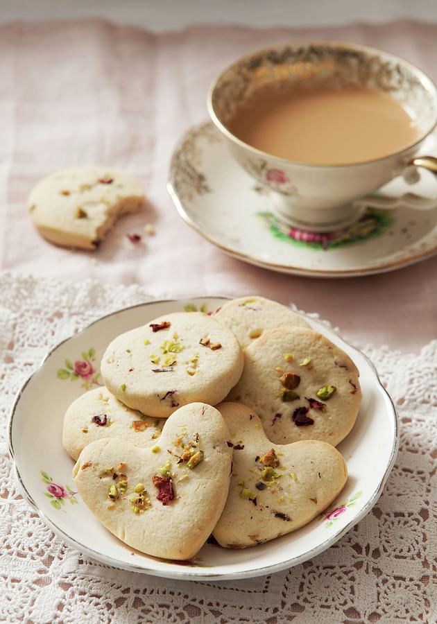 Cookies With Pistachios And Dried Rose Petals, Served With A Cup Of Coffee Photograph by Stacy Grant