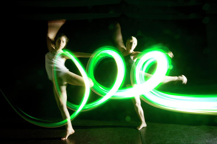Coordinated Dancers In Green Abstract Photograph by John Rensten