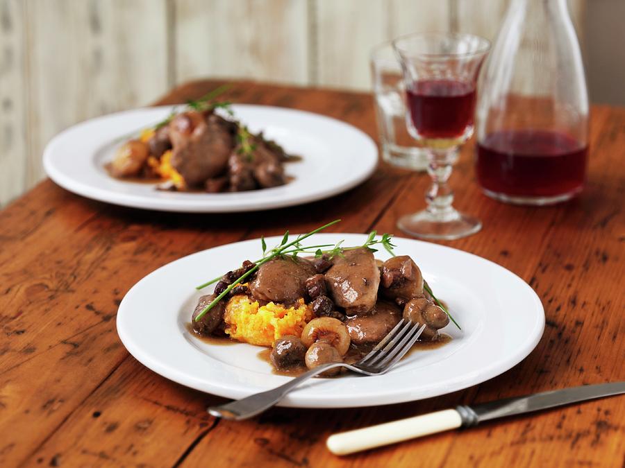 Coq Au Vin Served On Butternut Squash Pure With Thyme And Chives Photograph by Frank Adam