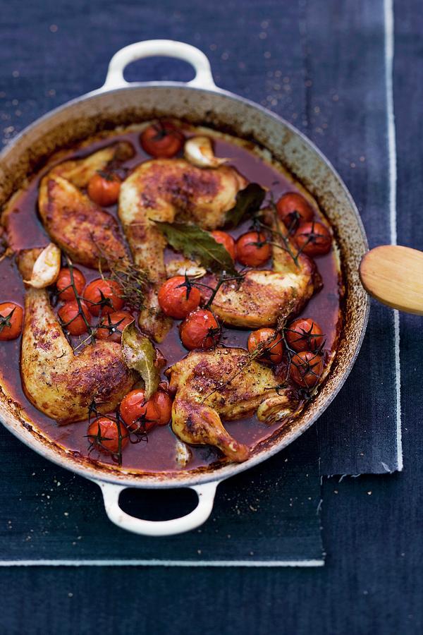 Coq Au Vin With Cherry Tomatoes Photograph by Michael Wissing