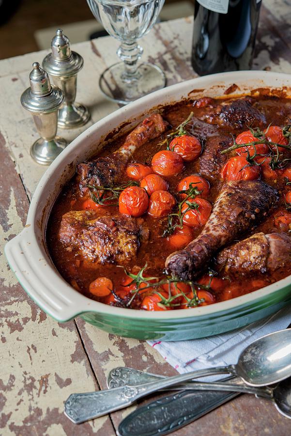 Coq Au Vin With Cherry Tomatoes Photograph by Sebastian Schollmeyer