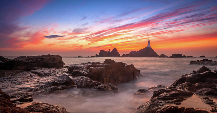 Corbiere Lighthouse In Jersey Photograph by Jason Masterman