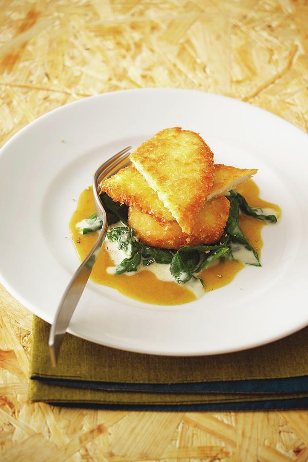 Corn-fed Chicken Escalope In A Potato Coating With Spinach And Apple Curry Sauce Photograph by Michael Wissing