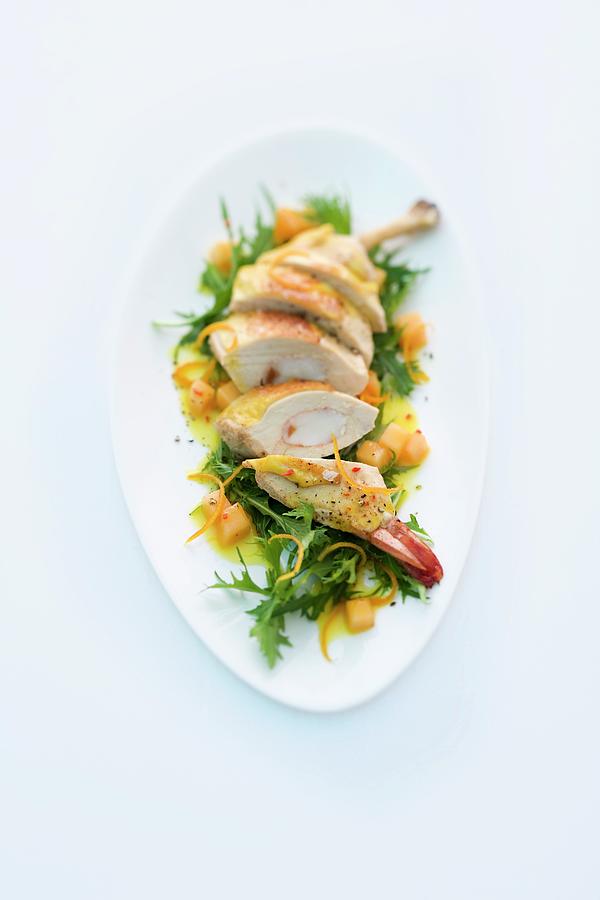 Corn-fed Chicken Filled With Prawns On A Bed Of Rocket With An Orange And Melon Dressing Photograph by Michael Wissing