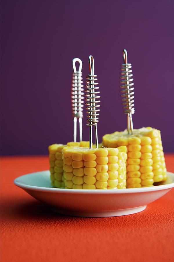 Corncobs On Forks Photograph by Michael Wissing