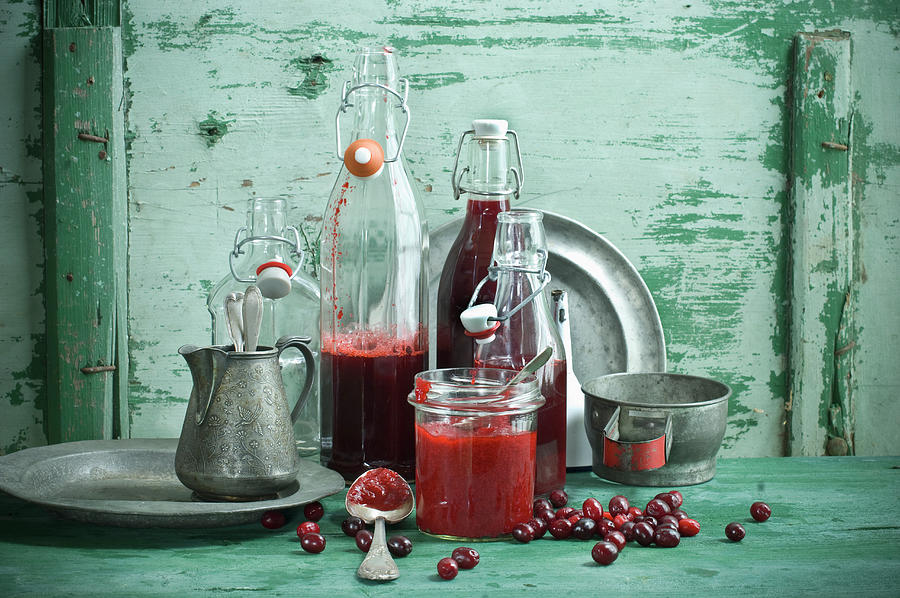 Cornelian Cherry Juice In Bottles And Cornelian Cherry Jam In A Jar Photograph by Achim Sass