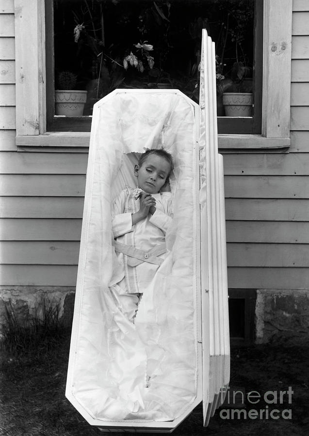 Corpse Of Young Boy In Open Coffin Photograph by Bettmann