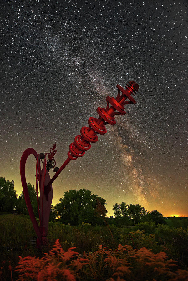 Cosmic Ray Gun #3 - Red Sculpture on hilltop with summer milky way Photograph by Peter Herman