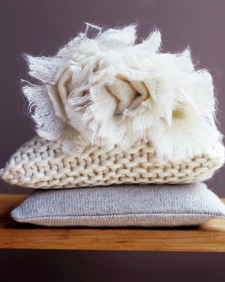Still Life Photograph - Cosy Cushions And Rolled, Off-white Blanket by Matteo Manduzio