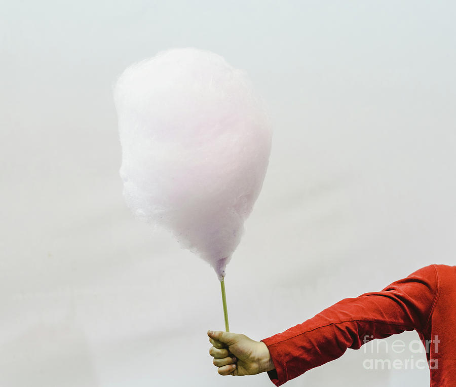Cotton Candy Held By The Hand Of A Child, Isolated On White Background. Photograph by Joaquin Corbalan