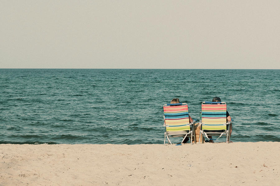 Couple At The Beach Sitting On Beach Chairs Digital Art by Laura Diez