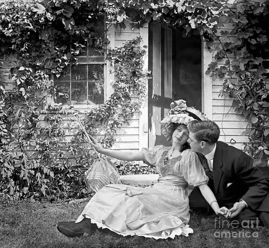 Couple Courting On Lawn Of Ivy Covered Photograph by Bettmann