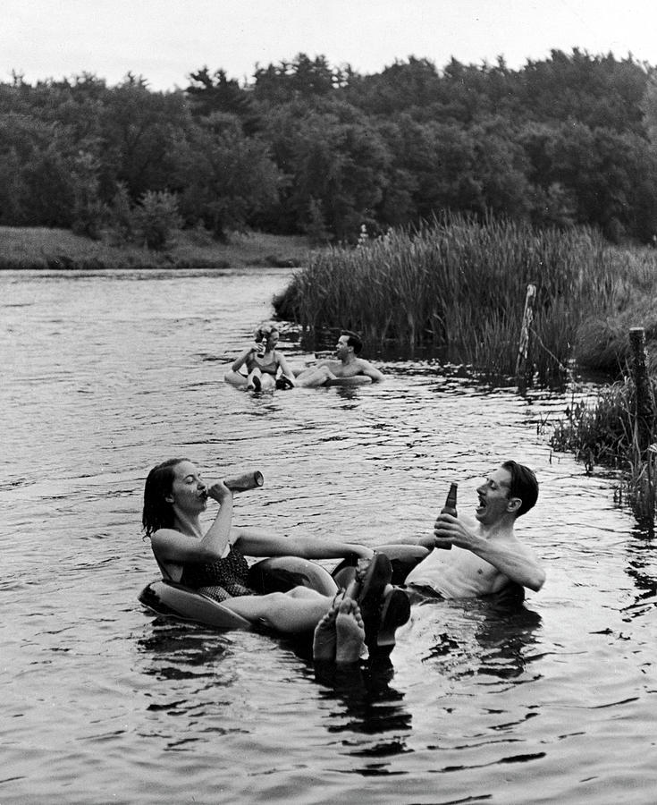 Couple Drinking Beer At Inner Tube Photograph by Alfred Eisenstaedt Couple Drinking Beer At Inner Tube Photograph by Alfred Eisenstaedt