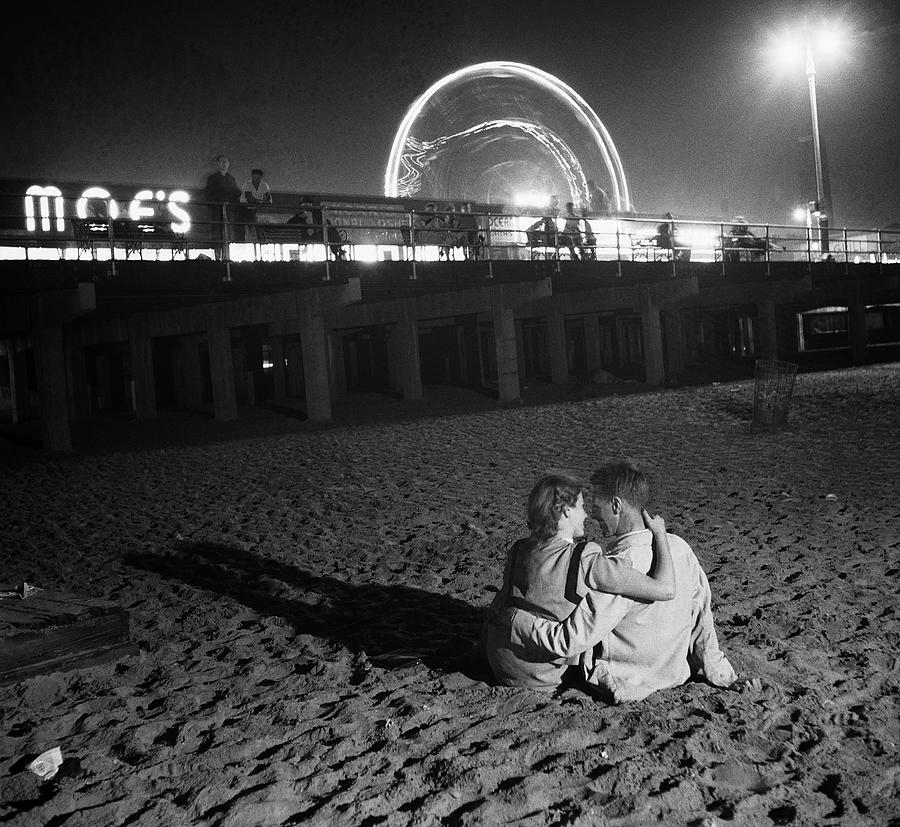 Couple Embracing On Coney Island Beach Photograph by Bettmann