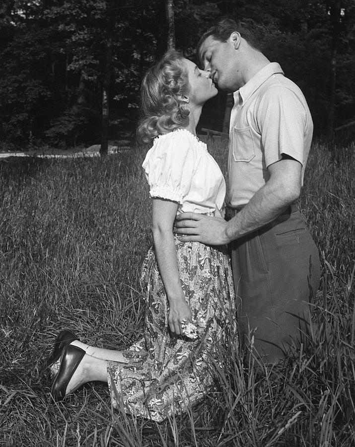 Couple Kissing Outdoors Photograph by George Marks