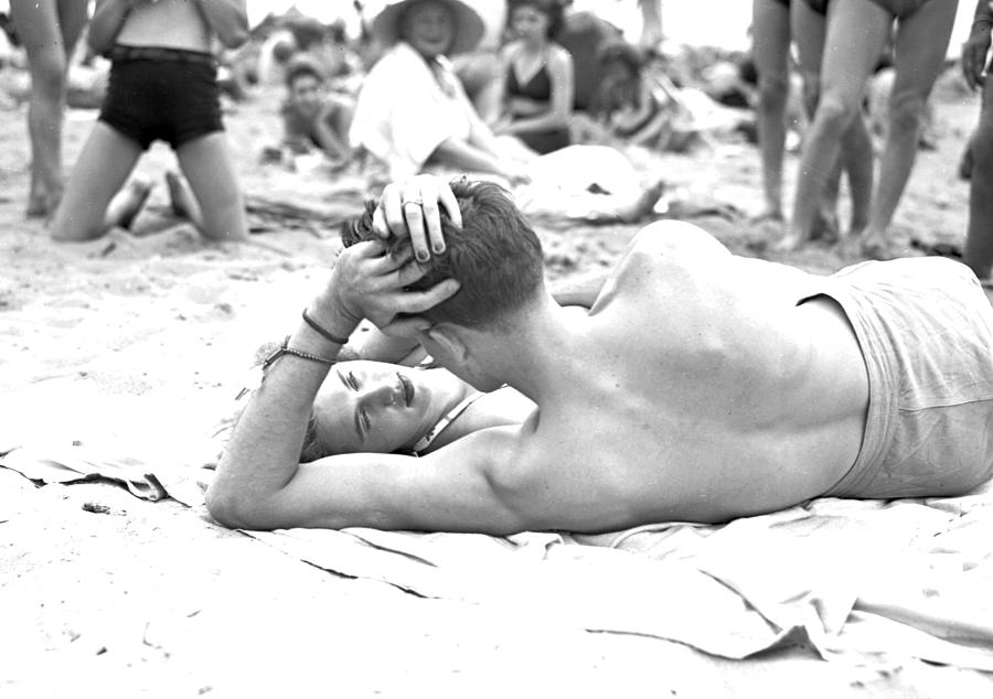 Couple Lies On The Beach At Coney Photograph by New York Daily News Archive