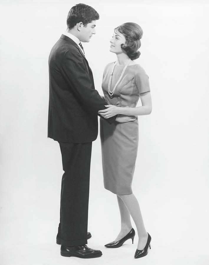 Couple Looking In Eyes In Studio, B&w Photograph by George Marks