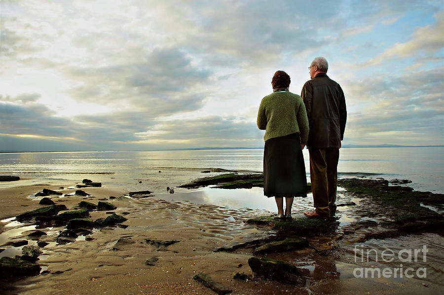 Couple On A Beach Photograph by Science Photo Library