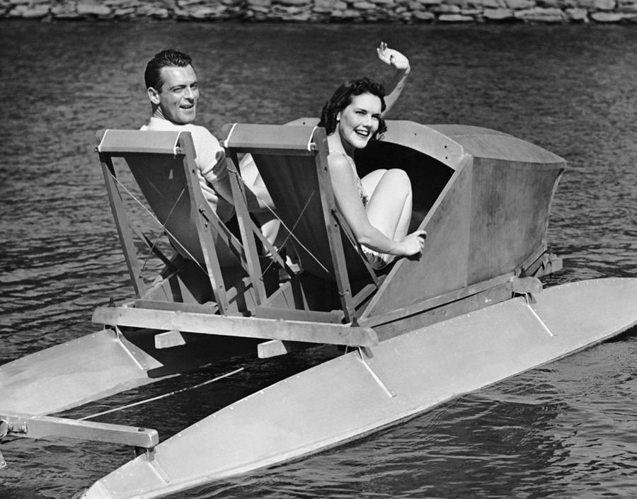 Couple On Lake In Paddle Boat Photograph by George Marks