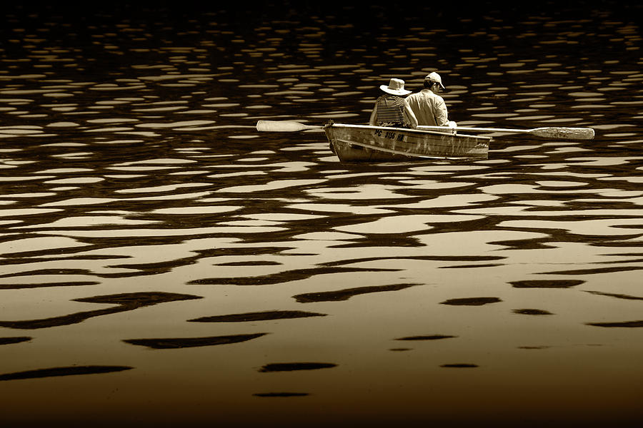 Couple rowing on Stoney Lake at Sunrise in Sepia Tone Photograph by Randall Nyhof