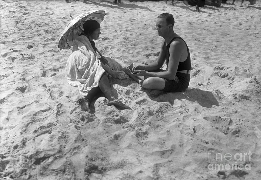 Couple Sitting On Beach Palm Beach Photograph by Bettmann