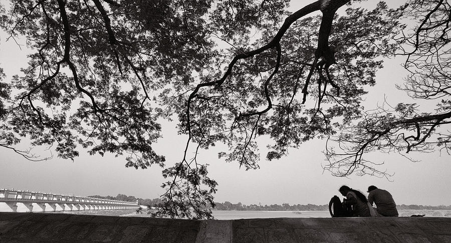 Tree Photograph - Couple sitting under tree by Krishnan Srinivasan