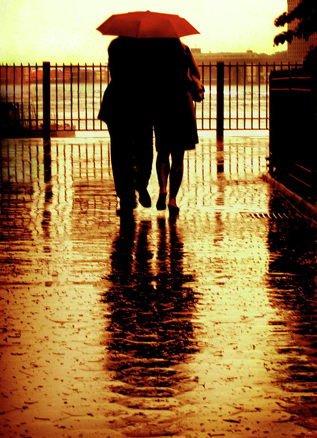 Couple Strolling Under Umbrella Photograph by © Rick Elkins