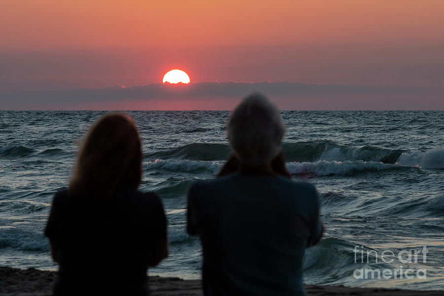 Couple Watching The Sunset Over Lake Michigan Photograph by Jim West/science Photo Library