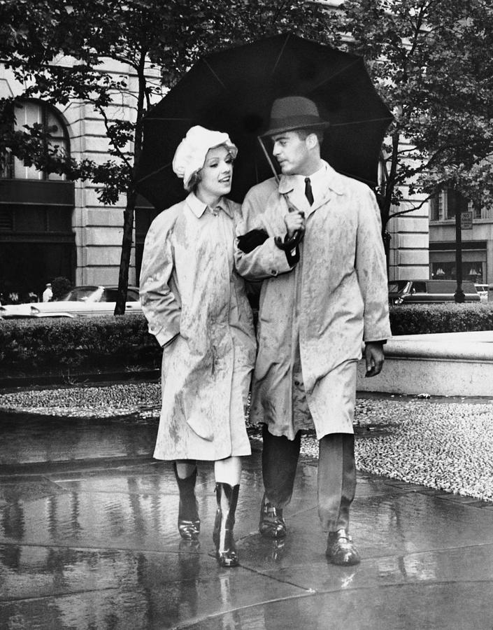 Black And White Photograph - Couple Wumbrella Walking In The Rain by George Marks